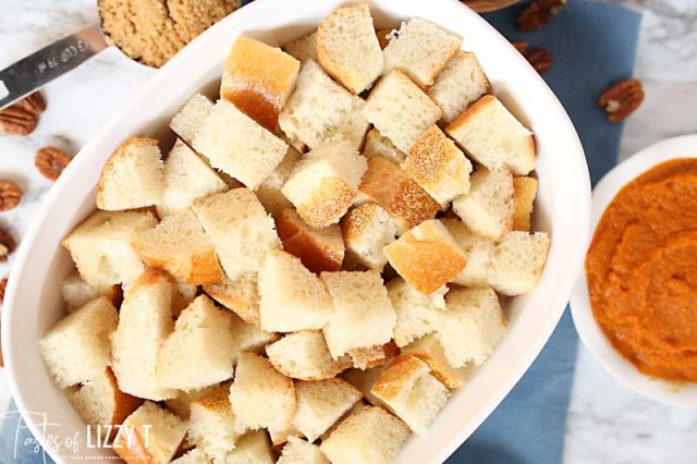 stale bread cubes in a pan