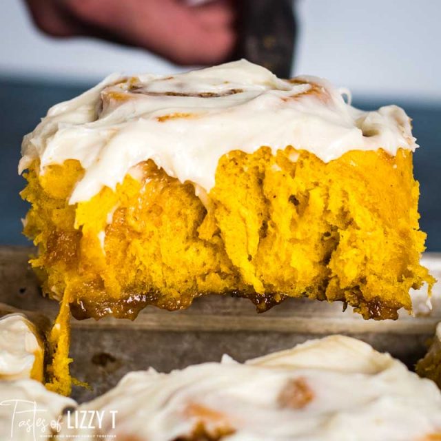 pumpkin cinnamon rolls on a spatula