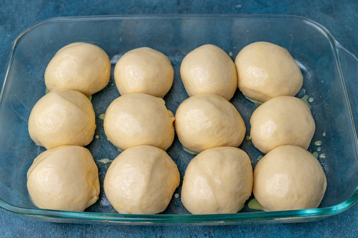 uncooked rolls in a glass pan