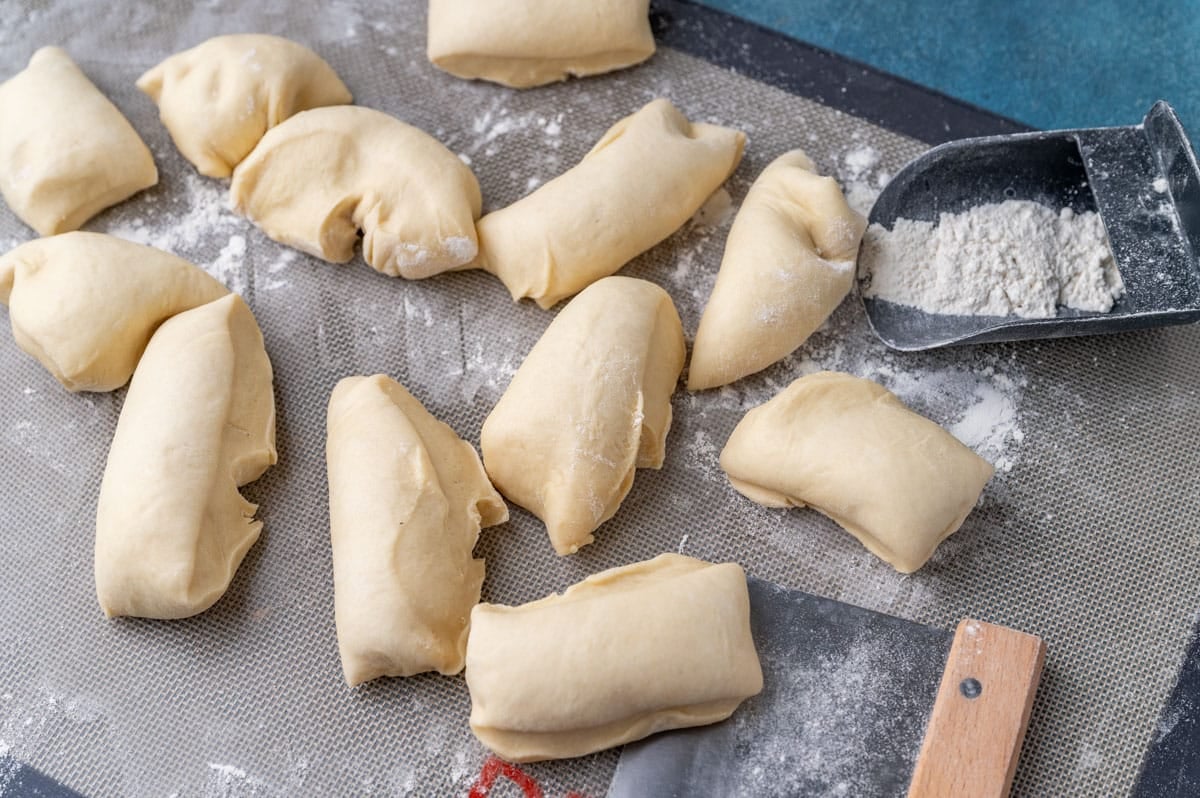 dough balls cut on a pastry mat