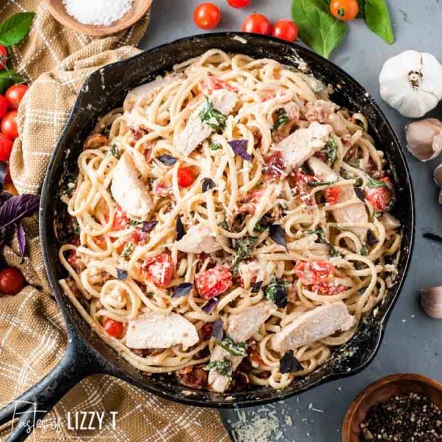 A pan filled with food, with Chicken and Pasta