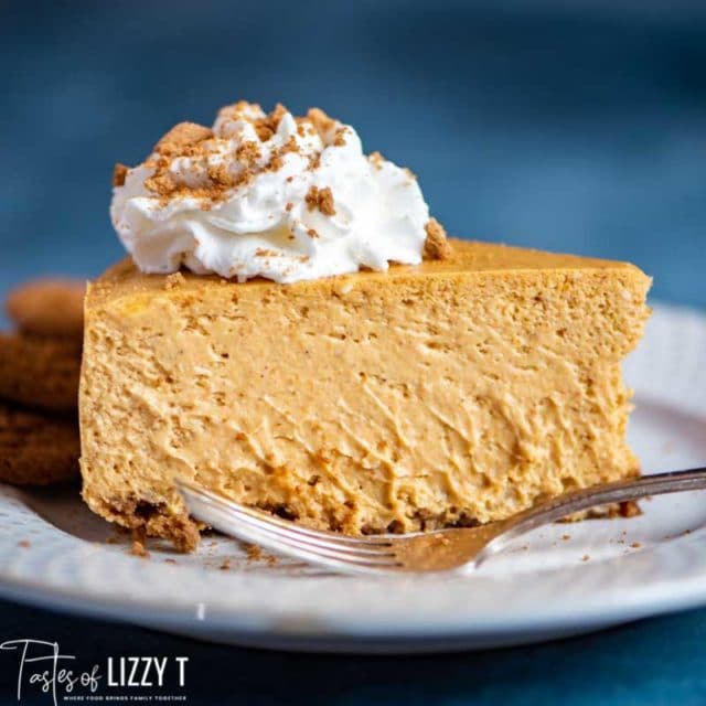 creamy Pumpkin Cheesecake with gingersnaps on a plate