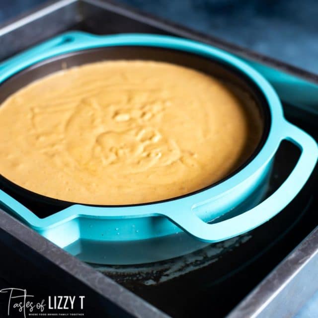 unbaked pumpkin cheesecake in a waterbath