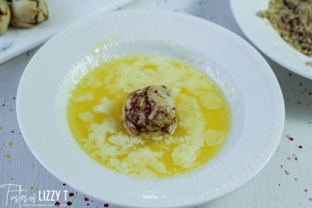 rolling dough in melted butter