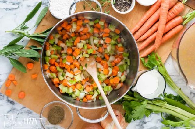 carrots, celery and onion in a pan