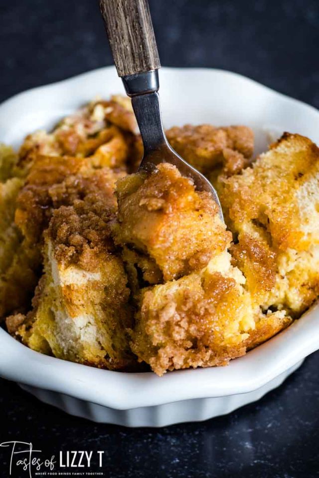 french toast casserole in a bowl with a fork