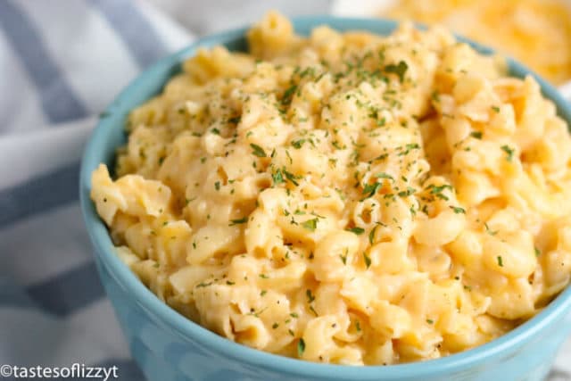 A bowl of food, with Cheese and Macaroni