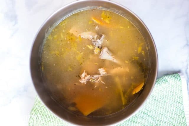 A bowl of soup, with turkey