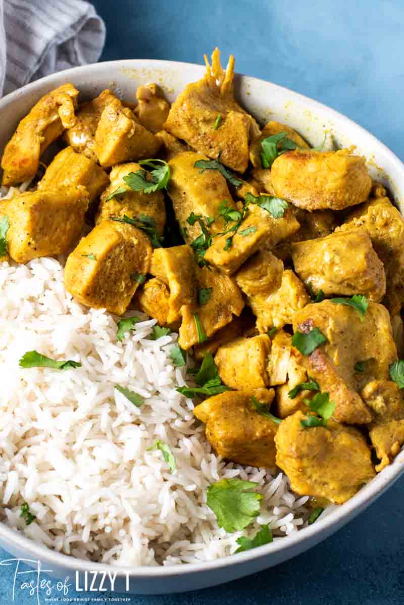 A plate full of food, with Curry and Chicken