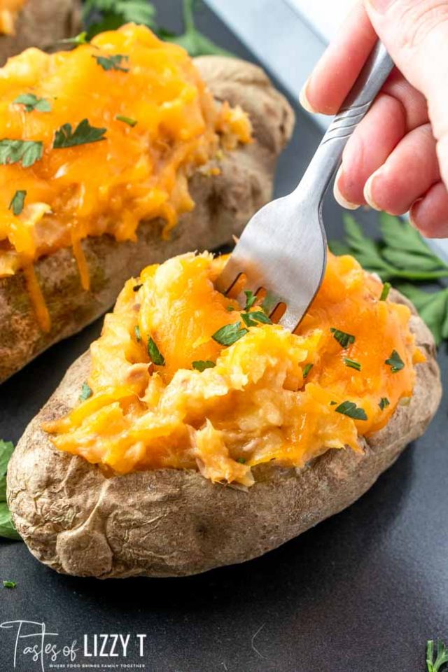 stuffed potatoes with a fork