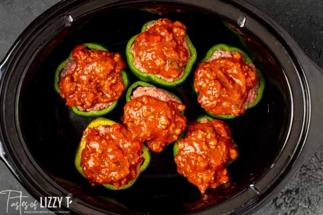 uncooked stuffed peppers with sauce