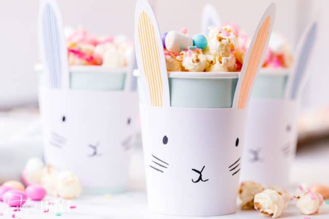 A close up of a cup of easter popcorn