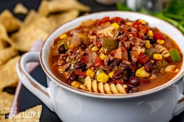 A bowl of food on a table, with Soup and Taco