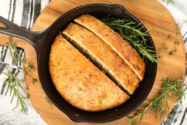 skillet with sliced rosemary bread