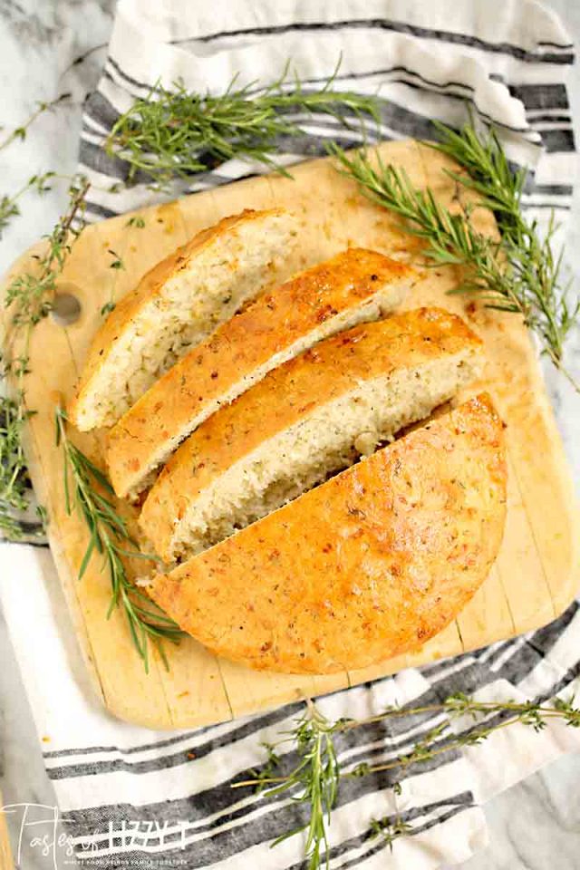 A close up of a plate of food with a slice cut out, with Bread and Dough