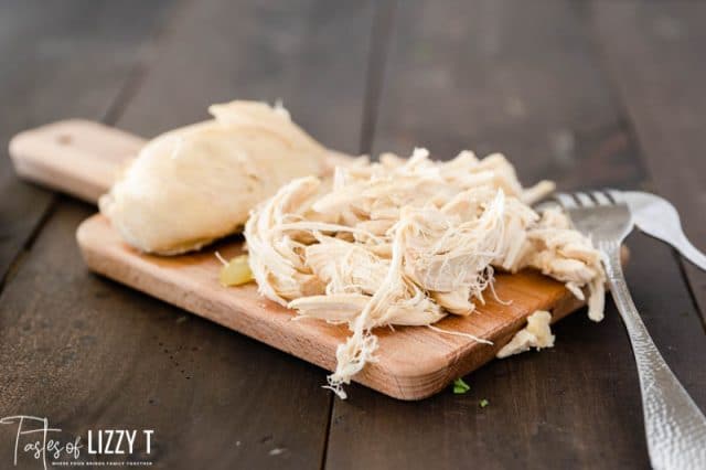 shredded chicken on a cutting board