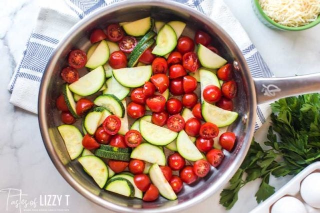 tomatoes and zucchini in a skillet