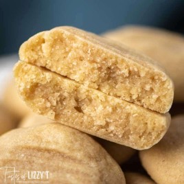 A close up of a butter cookie broken in half