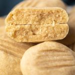 A close up of a butter cookie broken in half