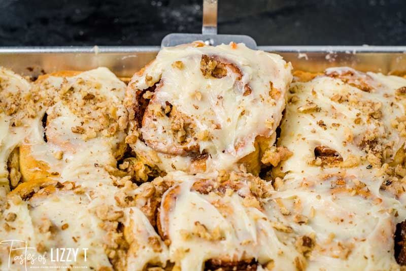 cinnamon rolls in pan with spatula