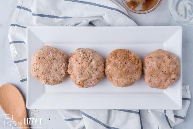 uncooked burger on a plate