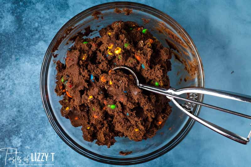 cookie dough in bowl with cookie scoop