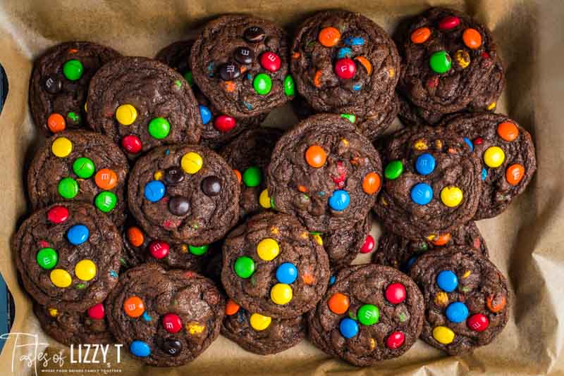 m&m chocolate cookies on parchment paper