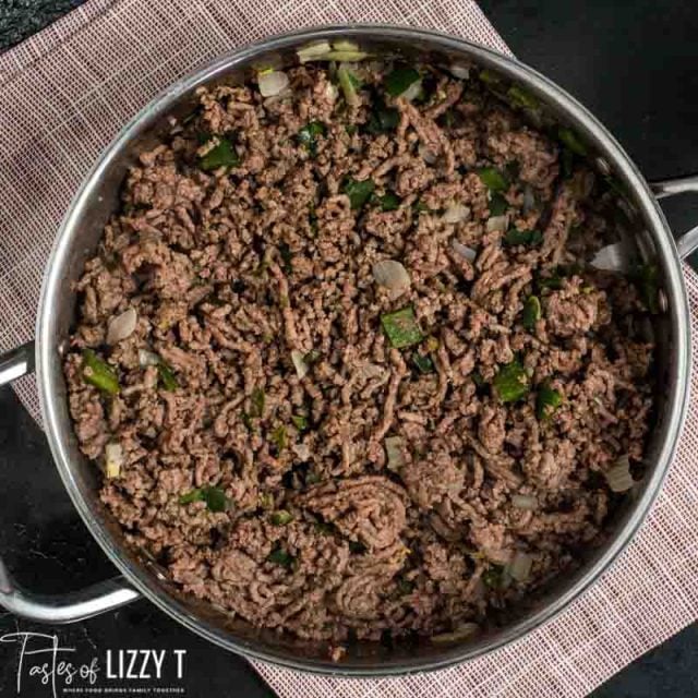 ground beef peppers and onions in a skillet