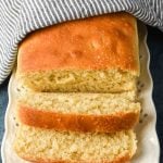 loaf of sourdough bread with two slices