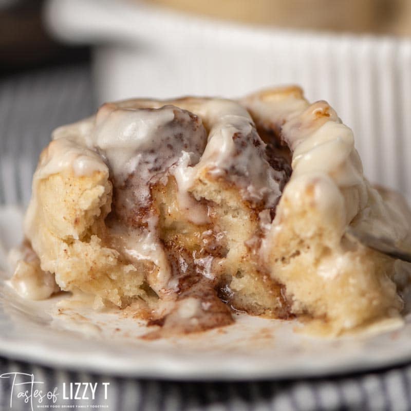 gooey bisquick cinnamon roll cut open on a plate