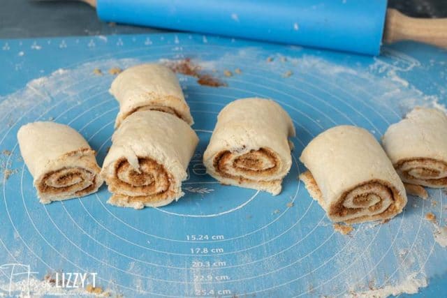 unbaked bisquick cinnamon rolls on a pastry mat