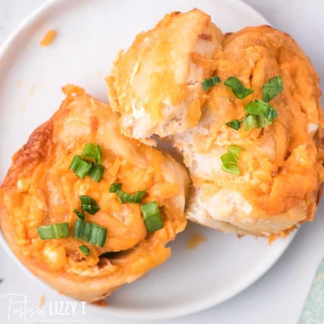 two buffalo chicken pinwheels on a plate