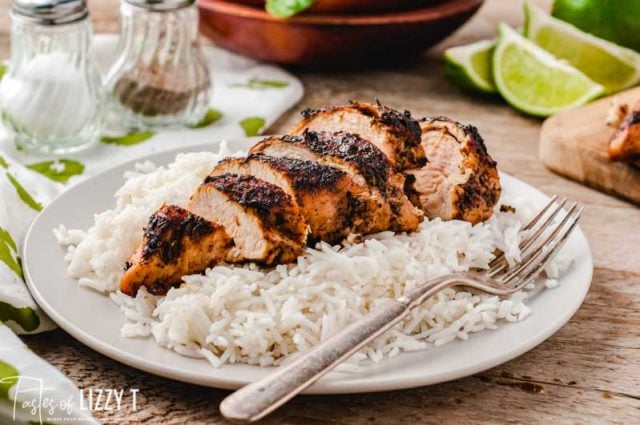 blackened chicken on a plate with rice