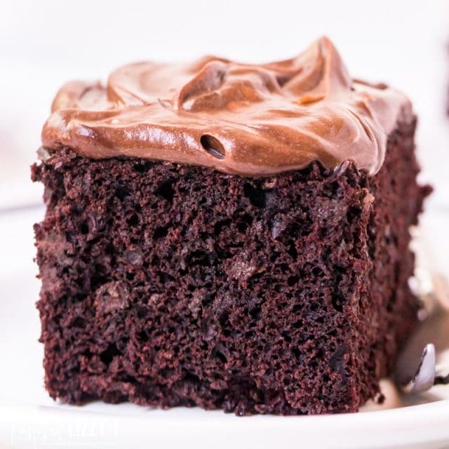 piece of chocolate cake with chocolate frosting on a plate