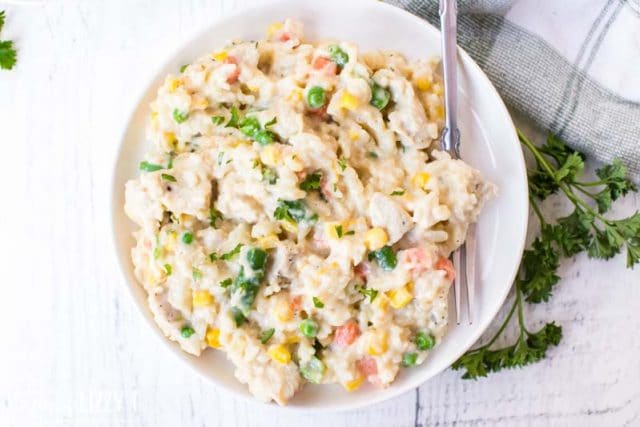 creamy chicken and rice on a plate with a fork