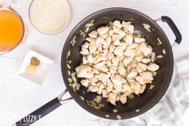 cihcken and onions in a skillet