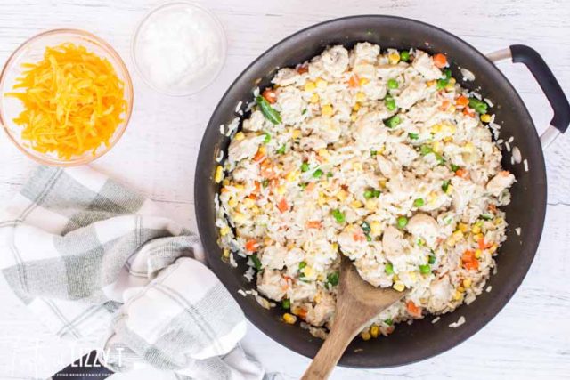 rice, chicken and veggies in a skillet