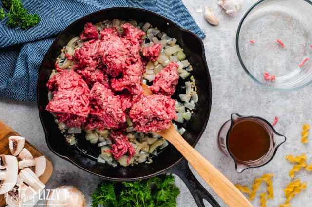 ground beef in skillet with onions