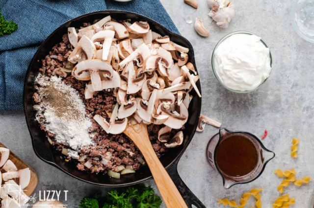 browned ground beef and mushrooms in skillet