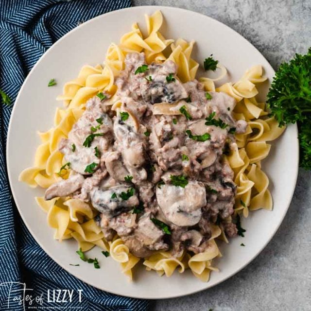 overhead shot of ground beef stroganoff over noodles