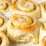 A close up of lemon poppy seed swet roll