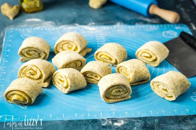 lemon poppy seed rolls cut on a pastry mat
