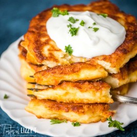 stack of potato cakes with sour cream