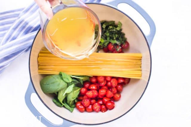 ingredients for one pot pasta in a dutch oven