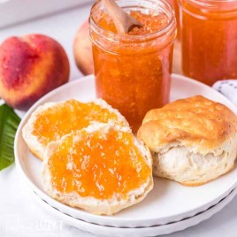Food on a plate, with peach jam