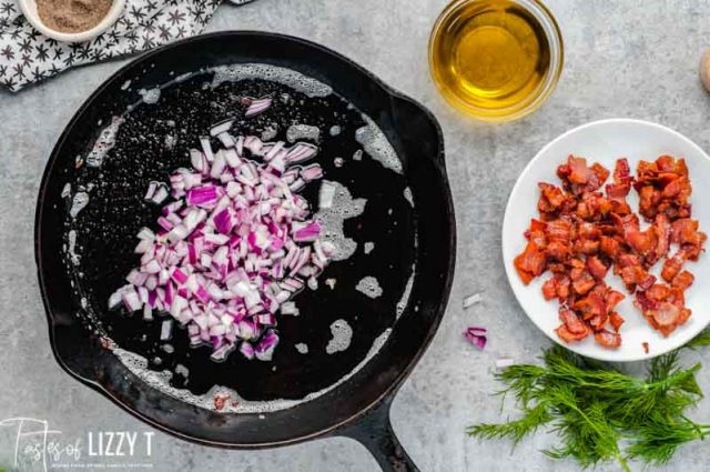 diced red onion in a cast iron skillet