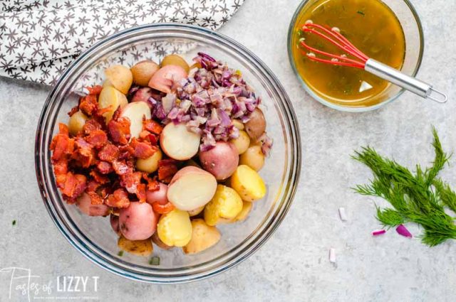 unmixed potato salad with mustard marinade