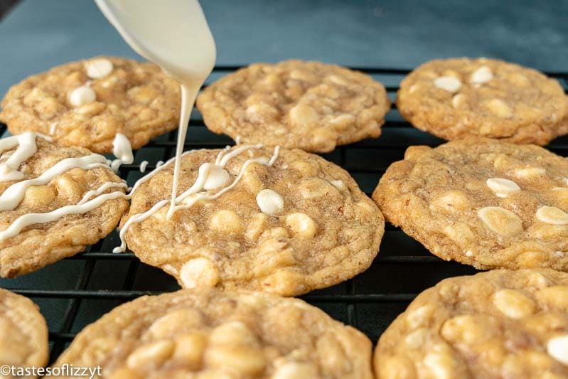 drizzling white chocolate on cookies