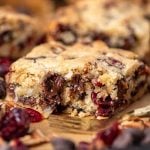 chocolate chunk cranberry coconut bars with a bite out of it