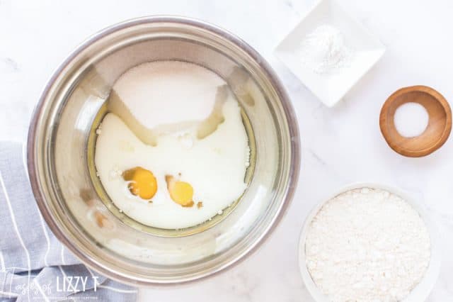 eggs, milk and oil in a mixing bowl